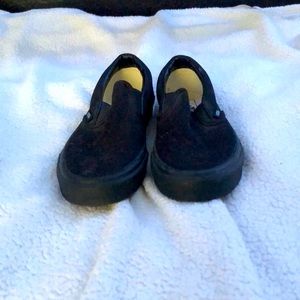 All black slip on vans